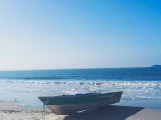blue boat under blue sky