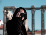 woman in black jacket wearing black sunglasses