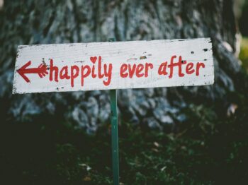 gray and red happily ever after wooden signage